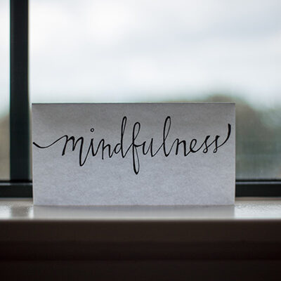 Photo of the word mindfullness on a windowsill